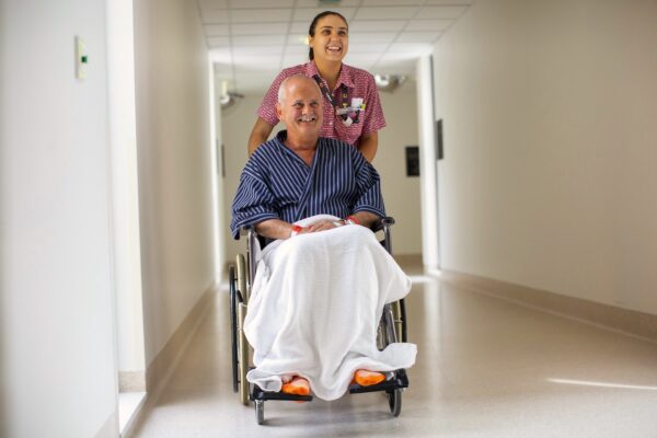 ACL - male patient in wheelchair and female nurse