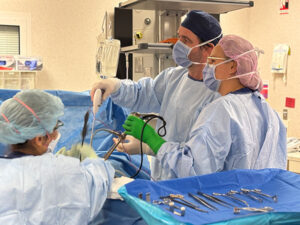 Associate Professor Chris Merry operating NLCSP patient Patrick Griffin