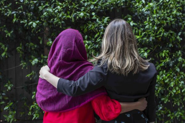 Asylum-Seeker-hugging-support-person