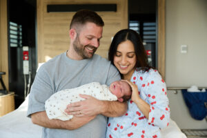 Cabrini Maternity - new parents admiring their baby
