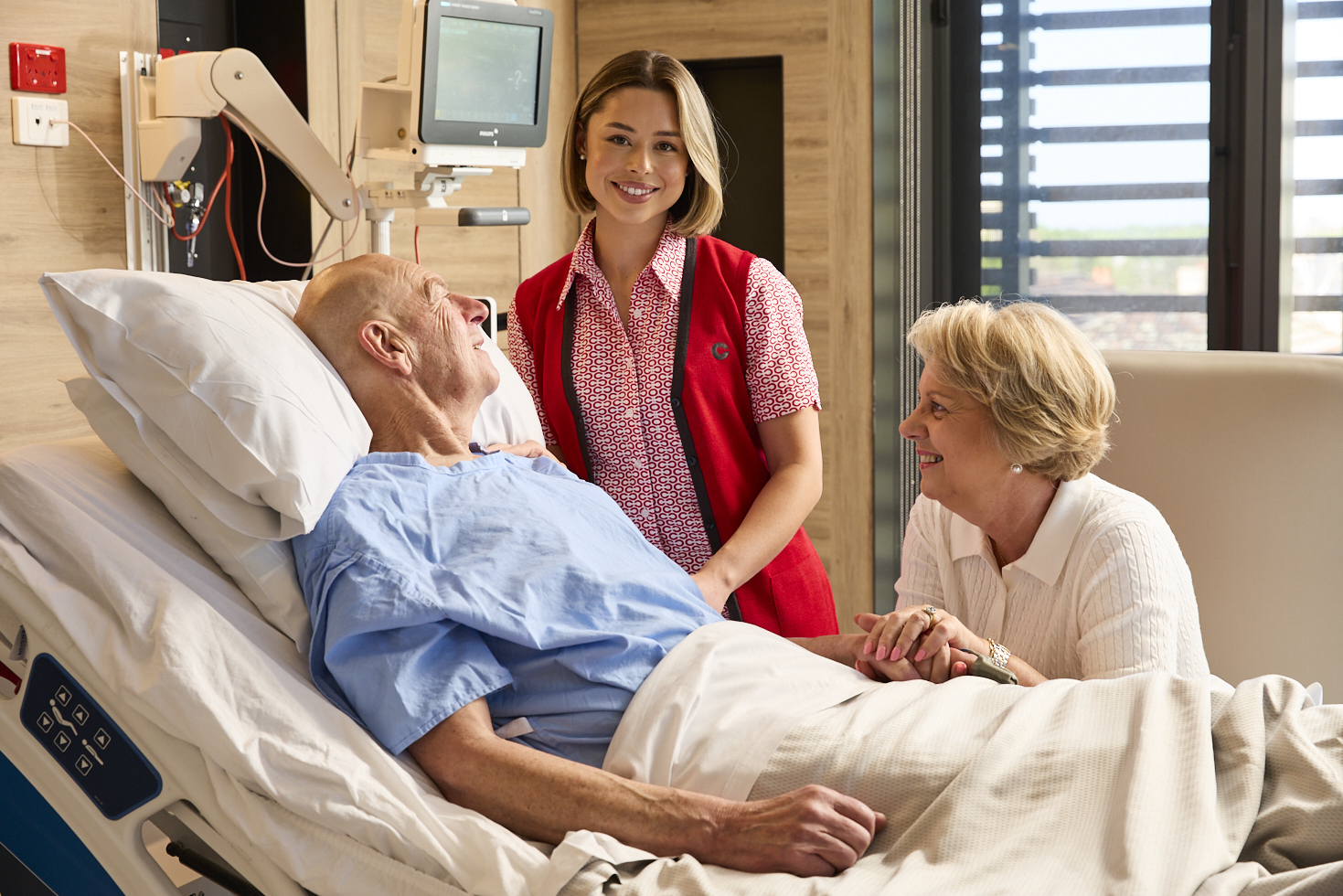 Cabrini Nurse with patient and their wife-Gandel Wing