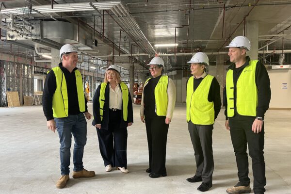 Cabrini’s theatre redevelopment project team meet with builders for a site tour