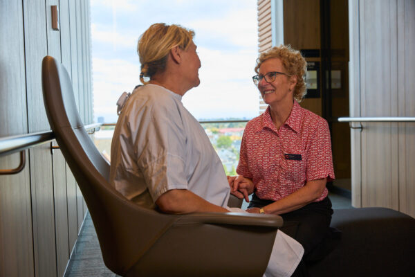 Cancer nurse speaking with female patient
