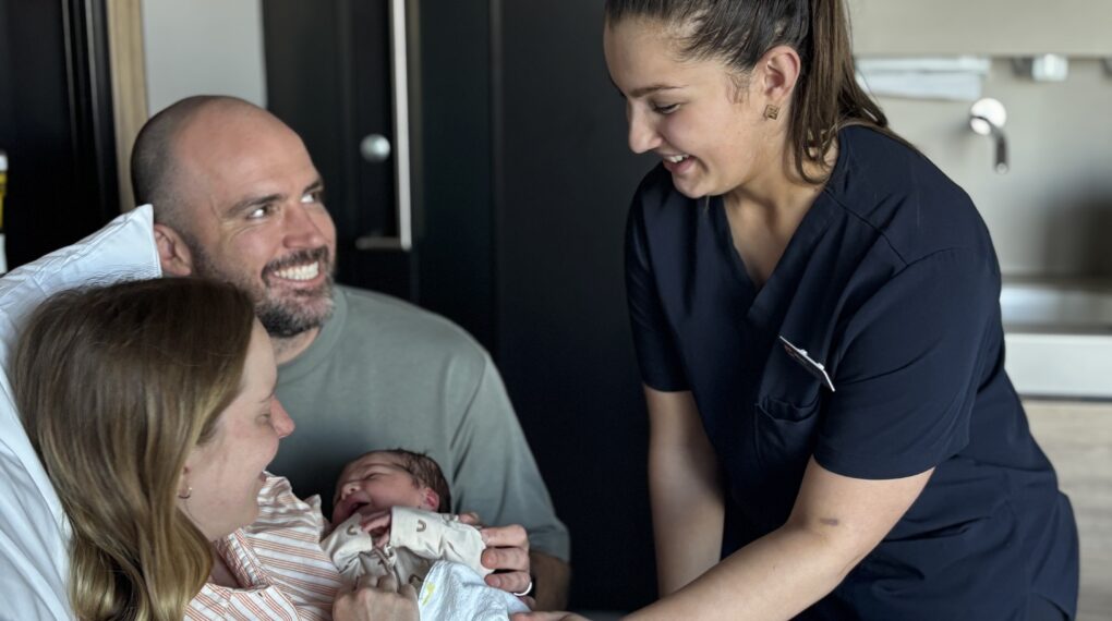 Cabrini Graduate midwife with parents and baby