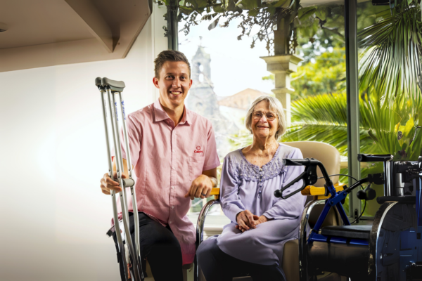 Female hip replacement patient with male physiotherapist