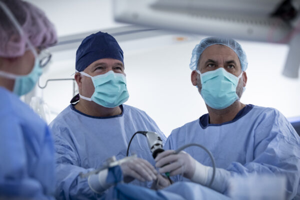 Surgeons conduct a laparoscopic surgery