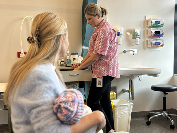 RSV nurse with mum and baby