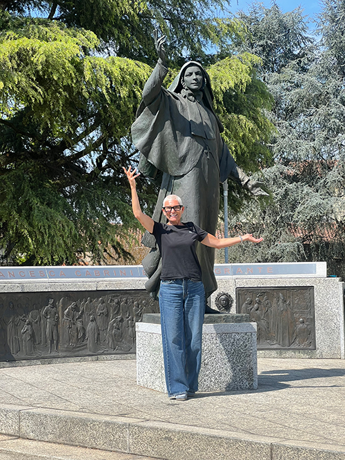 Sharon Sherwood with Mother Cabrini statue