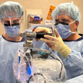Surgeon-using-Velys-robot-400x400
